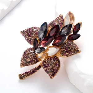 Vintage floral bouquet brooch with colorful rhinestones on a gold-plated base