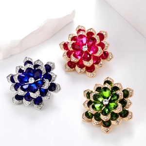 Elegant floral brooches with faceted crystals and rhinestones in pink, blue, and green colors