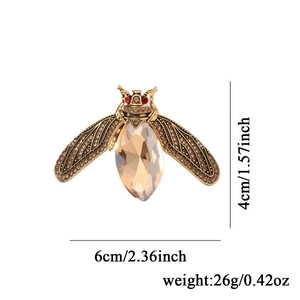 Elegant crystal bee brooch in champagne gold with detailed dimensions and 26g weight