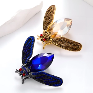 Elegant crystal insect brooches in gold and navy blue finishes with sparkling rhinestones
