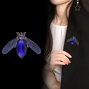 Exquisite vintage bee brooch with deep blue teardrop crystal and rhinestone wings