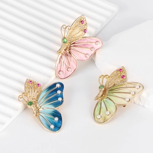 Broches papillon élégantes avec dégradé d'émail, perles fantaisie et cristaux