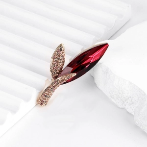 Elegant rose gold leaf brooch with deep red marquise crystal and sparkling pavé rhinestones