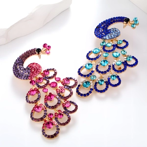 Elegant peacock brooch with colorful rhinestones in pink and blue crystal finish