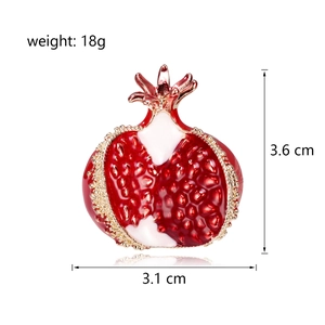 Red enamel pomegranate brooch in gold-plated metal, dimensions 3.6cm by 3.1cm