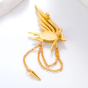 Broche phénix dorée luxueuse avec des chaînes à pampilles élégantes et métal mat