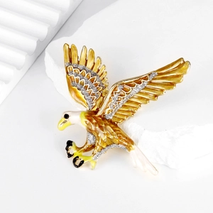 Vintage golden eagle brooch with spreading wings and silver sparkling enamel details