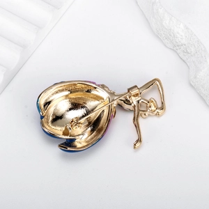 Elegant ballerina brooch with gold finish and enamel details shown from the back view