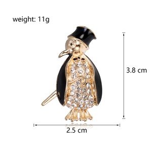 Elegant penguin brooch with rhinestones and enamel, measuring 3.8 cm in height