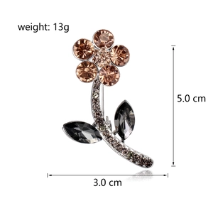Elegant crystal flower brooch with champagne rhinestones and silver base for evening dresses
