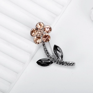Elegant silver flower brooch with champagne crystals and black rhinestones for women