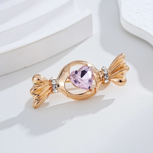 Broche exquise en forme de bonbon avec cristal cœur rose et strass sur base dorée
