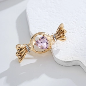 Broche bonbon dorée raffinée avec cristal de cœur rose et strass brillants scintillants