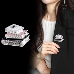 Creative three-book stack brooch with rhinestones and bowknot for suits and coats