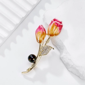 Elegant tulip brooch with pink enamel petals, gold leaves, and a dark lustrous pearl
