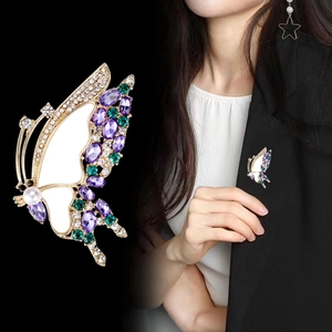 Elegant butterfly brooch with purple crystals and pearl on gold base for women
