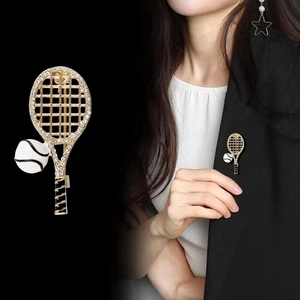 Creative tennis racket brooch with gold frame, sparkling crystals and enamel tennis ball