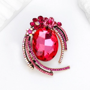Elegant vintage alloy brooch with large red crystal and floral rhinestone details