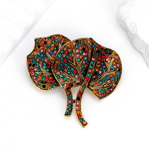 Luxurious ginkgo leaf brooch in antique gold finish with colorful sparkling rhinestones