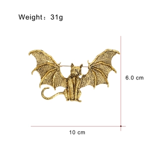 Vintage gold flying cat bat brooch pin with 10cm wingspan on white background