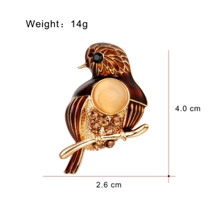 Broche oiseau de mode avec émail ambré et strass sur base en métal doré