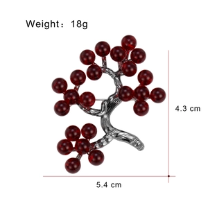 Elegant holly berry brooch with red glass beads and silver branches, size 5.4cm x 4.3cm