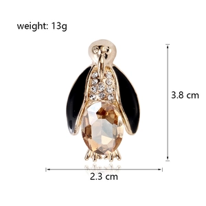 Cute penguin brooch in gold-tone metal with champagne gemstone and white rhinestones