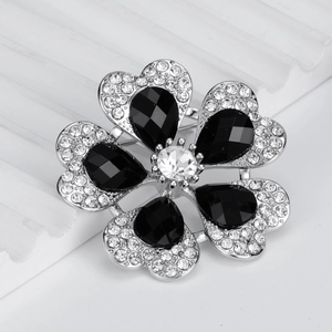 Broche fleurie en argent avec gemmes noires en goutte et accents de strass brillants