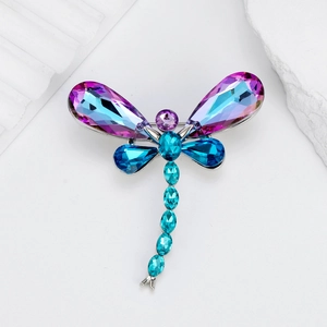 Luxurious dragonfly brooch featuring colorful multi-faceted crystals on a silver base
