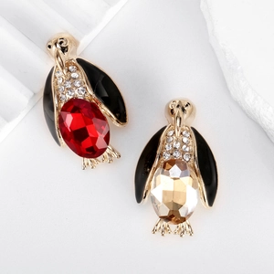 Elegant pair of penguin brooches with gold plating and colorful gemstone accents