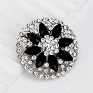 Elegant floral round brooch with black marquise crystals and white rhinestones