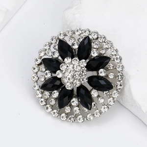 Elegant silver flower brooch with black marquise crystals and sparkling white rhinestones