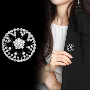 Elegant vintage starburst brooch with black crystals and rhinestones for women