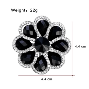 Elegant 4.4cm floral brooch with black stones and silver rhinestones on a white background