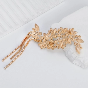Vintage golden leaf brooch with sparkling rhinestones and dangling fringe chain tassels