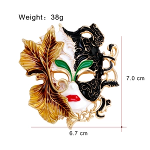 3D embossed Chinese mask brooch with golden leaves, black and white enamel finish