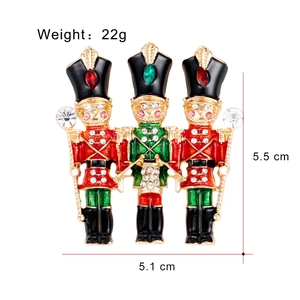 Cartoon Nutcracker soldier brooch in red and green enamel with sparkling rhinestones