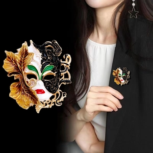 Italian style Venetian mask brooch with black white enamel and gold leaf details