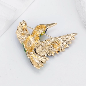 Exquisite hummingbird brooch with gold plating and safety pin buckle back detail view