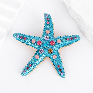 Exquisite sky blue starfish brooch with colorful rhinestones on a white minimalist background