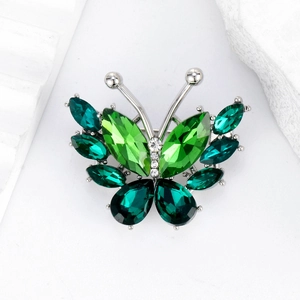 Exquisite crystal glass butterfly brooch in silver metal with green gemstone wings