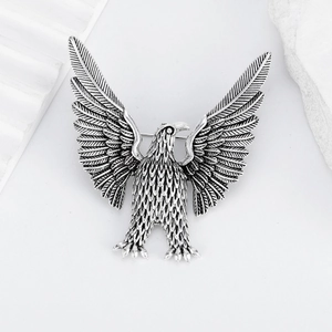 Vintage silver eagle brooch featuring intricate feather textures and a 3D flying pose