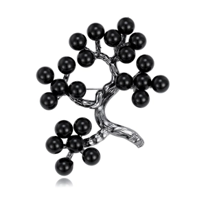 Elegant holly berry tree brooch in gunmetal grey with glossy black beads on white background