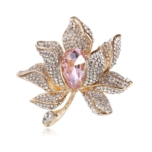 Detailed view of flower brooch featuring pink teardrop gemstone and crystal paving