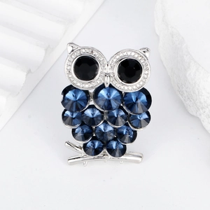Exquisite silver owl brooch with dark blue crystal feathers and zircon accents