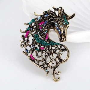Vintage bronze horse head brooch with colorful rhinestones and hollow-out detailing