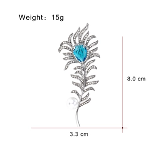 Elegant silver feather brooch with blue crystal, white pearl and sparkling rhinestones