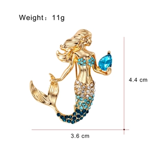 Exquisite gold mermaid brooch featuring blue rhinestones and crystal teardrop