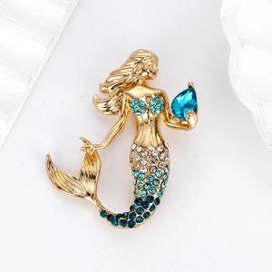 Exquisite mermaid brooch with blue crystal teardrop and sparkling rhinestones on gold base