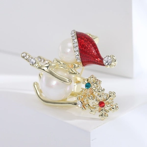 Broche bonhomme de neige de Noël avec perles blanches et strass sur traîneau doré